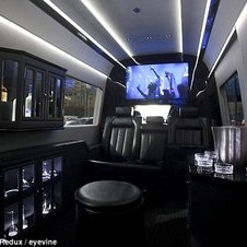 Driving commuters around the Benz: New York City's wealthiest enjoy hidden luxury in Mercedes vans that take up half the road