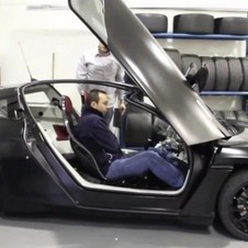 Delta E4 electric coupe goes out for a spin, carrying lucky humanoid