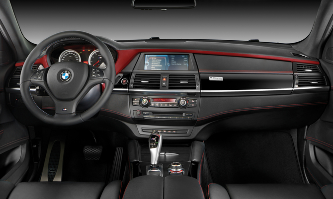 The interior gets Merino leather with red trim