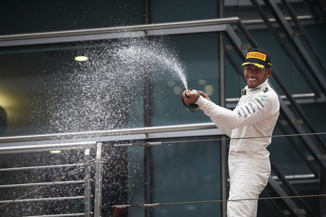 Hamilton celebrates his first win of the season in Shanghai Hamilton celebrates his first win of the season in Shanghai