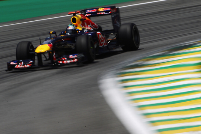 Vettel breaks record with pole in Brazil