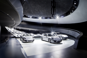 The interior has Porsche models in 1:3 scale and three current, real  cars