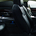 The rear seats are adjustable with a large console that has a beverage cooler and screens in the seats